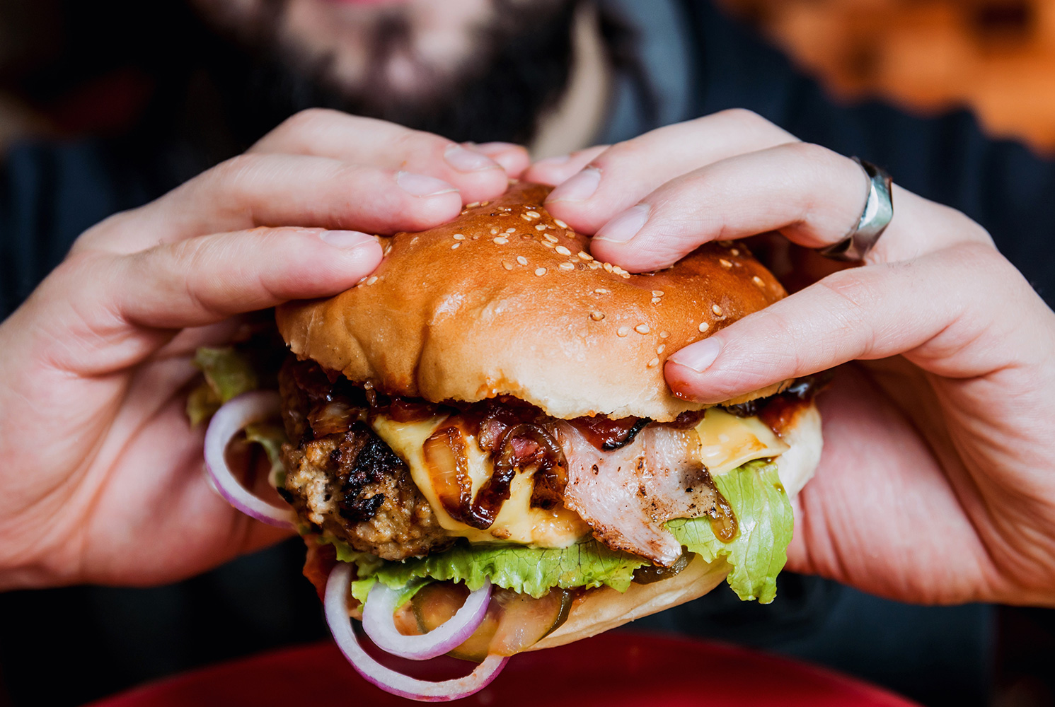 Cheeseburger in hand