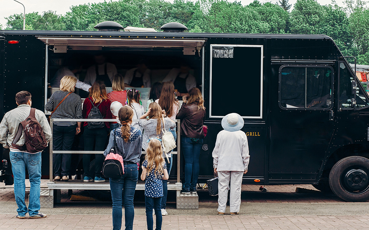 People Getting Food from a Food Truck